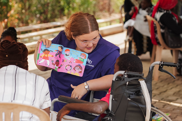 Kaleigh Reading To A Student